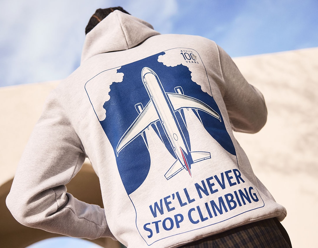 Back of a man wearing a Delta Centennial Hoodie