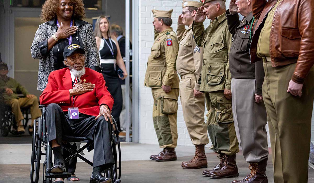 Normany Veteran Gets Salutes by Military Members
