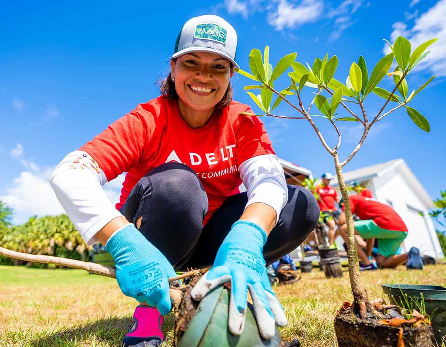 Delta Employee Planting Trees