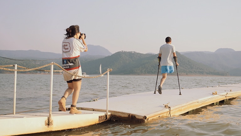 Photographer Seo Ju Park working on a dock