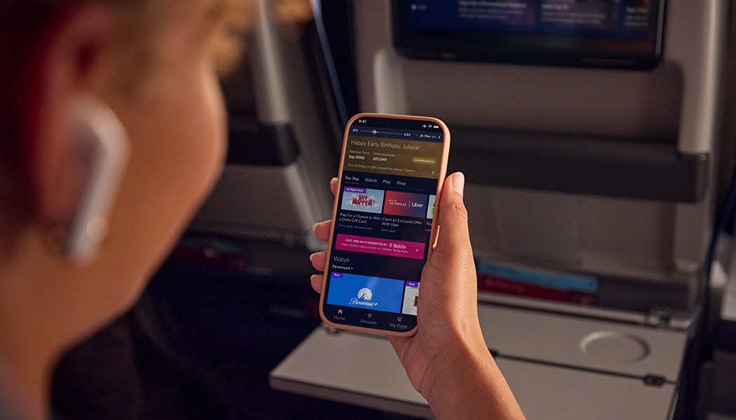 Woman using Delta Sync on smartphone