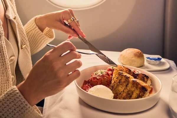 Woman eating in flight 