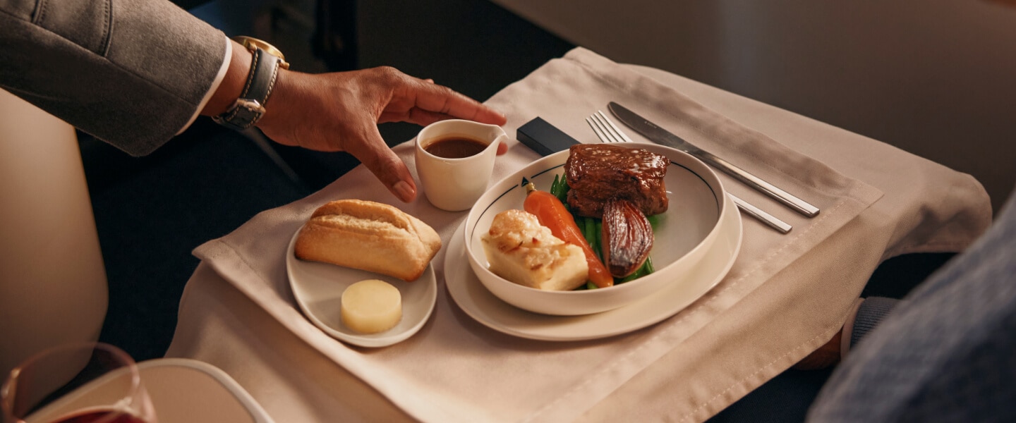 Meal being sereved in Delta One seat 
