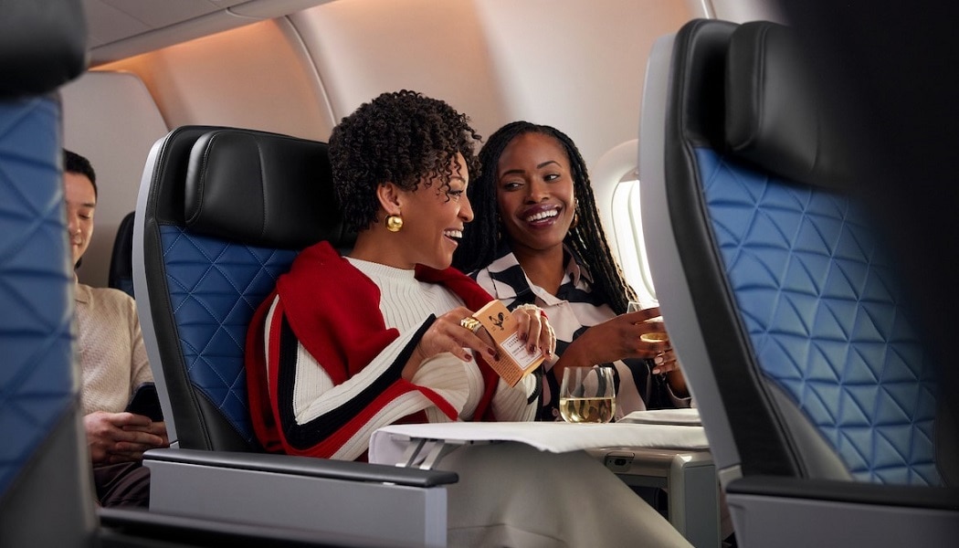 Two women enjoying a drink in Delta Premium Select
