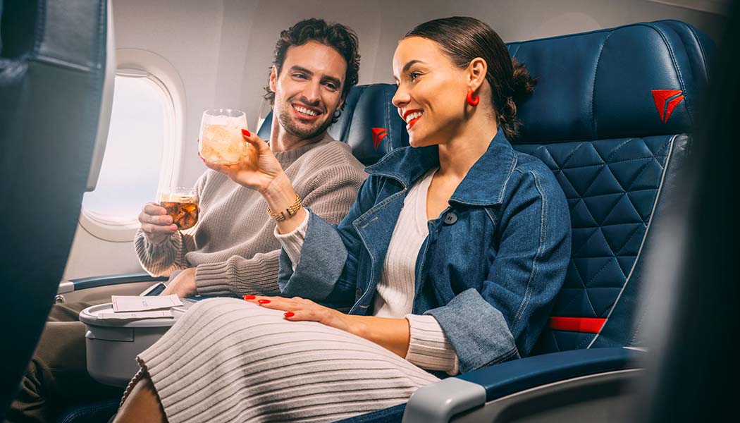 A couple enjoying beverages in Delta First