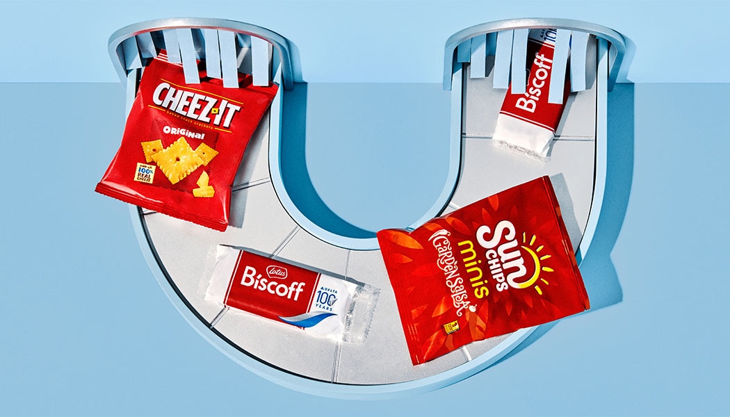 An assortment of onboard snacks, including Sun Chips, Biscoff Cookies, granola bars and snack mix