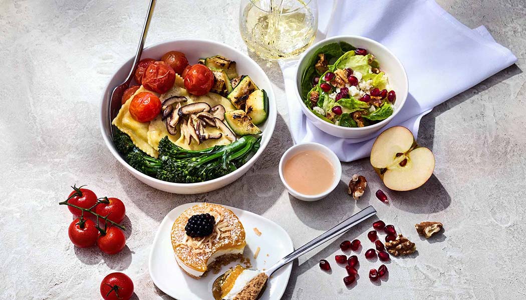 Assortment of plates and bowls full of chef-inspired foods