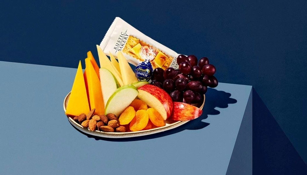 Fresh Flight Fuel Fruit and Cheese plate with almonds, apricots, and red grapes served on select Delta flights.