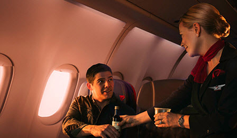 Flight attendant helping customer
