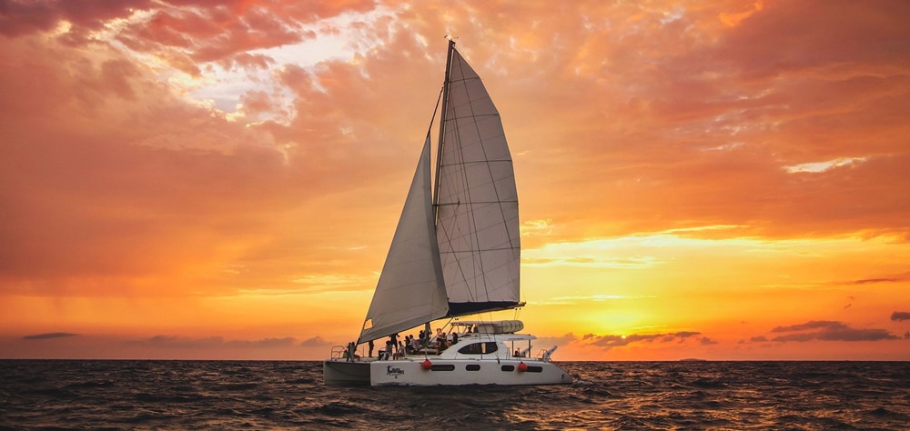Sunset boat over Cancun waters. 
