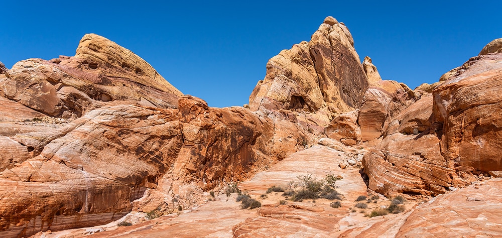 Red rock desert landscape with layered sandstone formations near Las Vegas. 